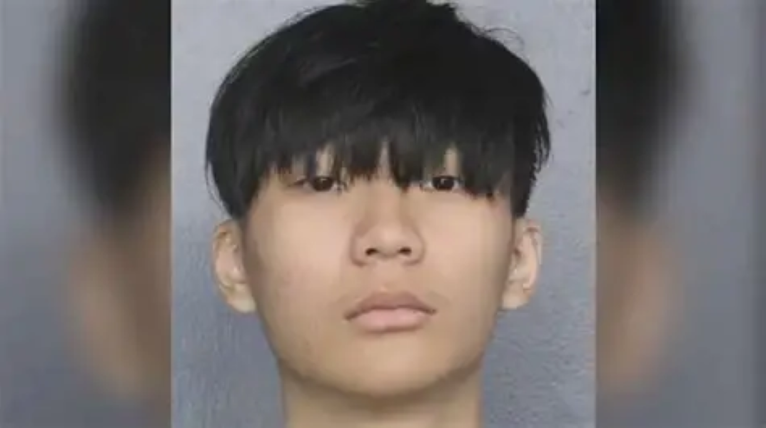 Picture of Malone Lam's face looking straight at camera in what appears to be a mug shot.